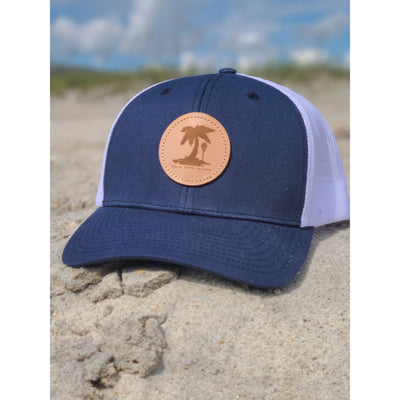 Navy beach hat on sand at beach near Palm Tree Island